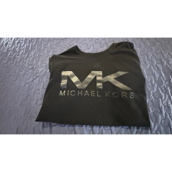 Michael Kors Tops - Michael Kors black t-shirt featuring a large, vertical metallic silver logo.
